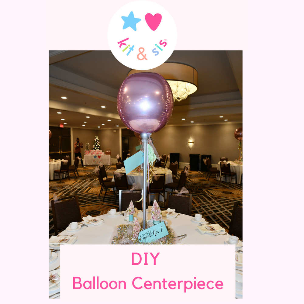 table decorated with DIY Balloon Centerpiece at Kit & Sis event